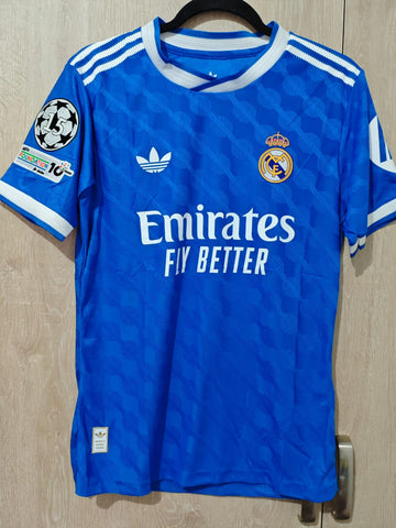 Jersey Real Madrid Azul alternativa 25/26 jugador con parches champions league